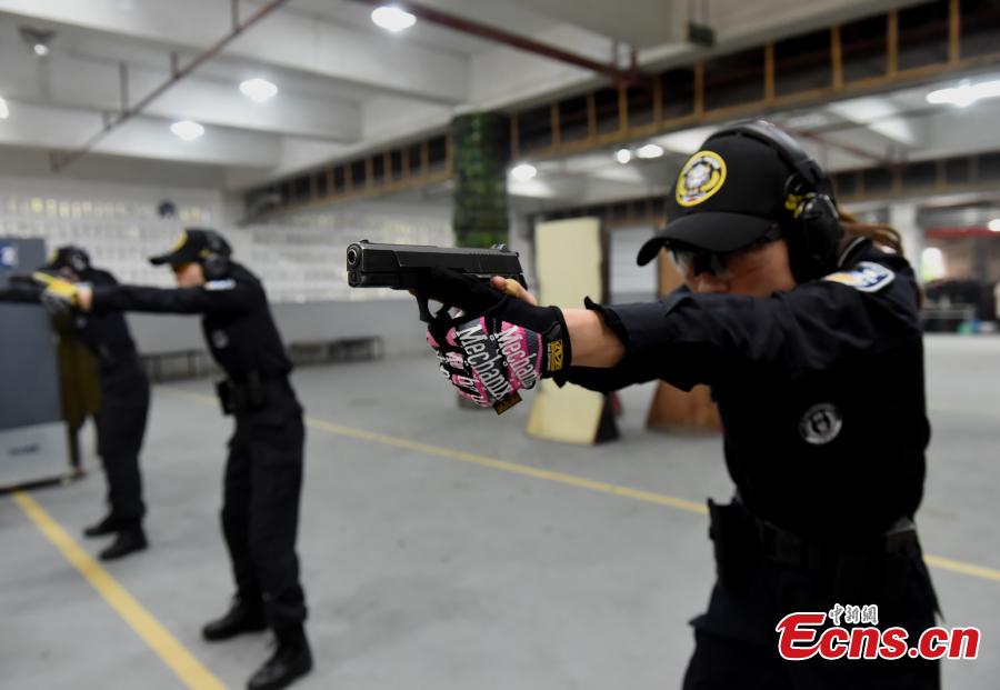 Members of a female special police taskforce of the Chongqing Public Security Bureau show their skills, including combat and firearm use, in an open day event on March 6, 2019, as part of activities to mark International Women\'s Day on March 8. (Photo: China News Service/Zhou Yi)