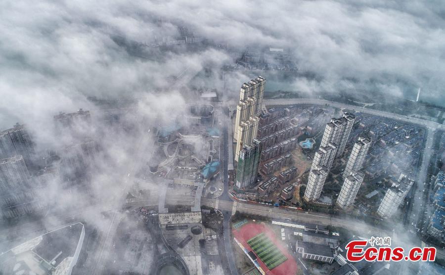 A drone photo taken on March 5, 2019 shows the skyline of Wuning County in Jiangxi Province under heavy fog. (Photo: China News Service/Luo Xingang)