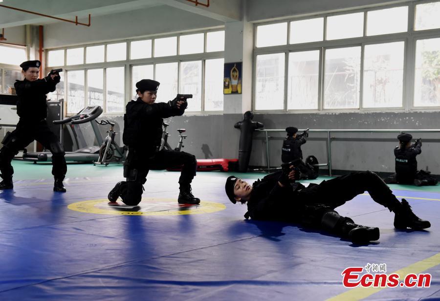 Members of a female special police taskforce of the Chongqing Public Security Bureau show their skills, including combat and firearm use, in an open day event on March 6, 2019, as part of activities to mark International Women\'s Day on March 8. (Photo: China News Service/Zhou Yi)