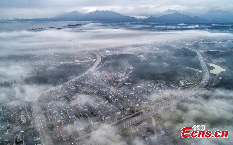 A drone photo taken on March 5, 2019 shows the skyline of Wuning County in Jiangxi Province under heavy fog. (Photo: China News Service/Luo Xingang)
