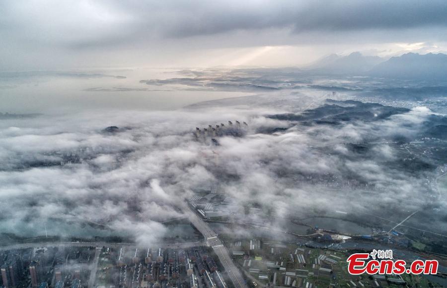A drone photo taken on March 5, 2019 shows the skyline of Wuning County in Jiangxi Province under heavy fog. (Photo: China News Service/Luo Xingang)