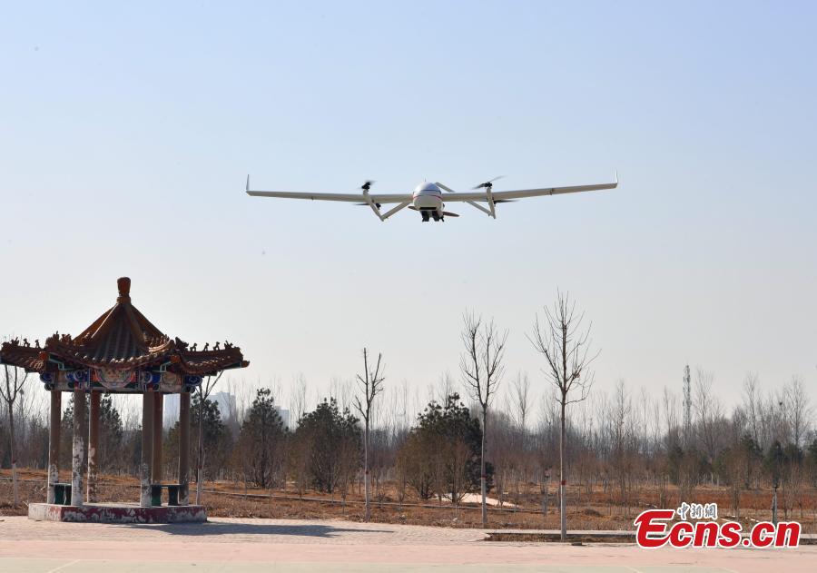 A drone put into use by Chengguan, urban management officers, in Shijiazhuang City, Hebei Province, March 7, 2019. The drone, with a wingspan of four meters, is used to take aerial photos of an area 138 square kilometres in size, to aid Chengguan in spotting open-air garbage and unapproved construction. (Photo: China News Service/Zhai Yujia)