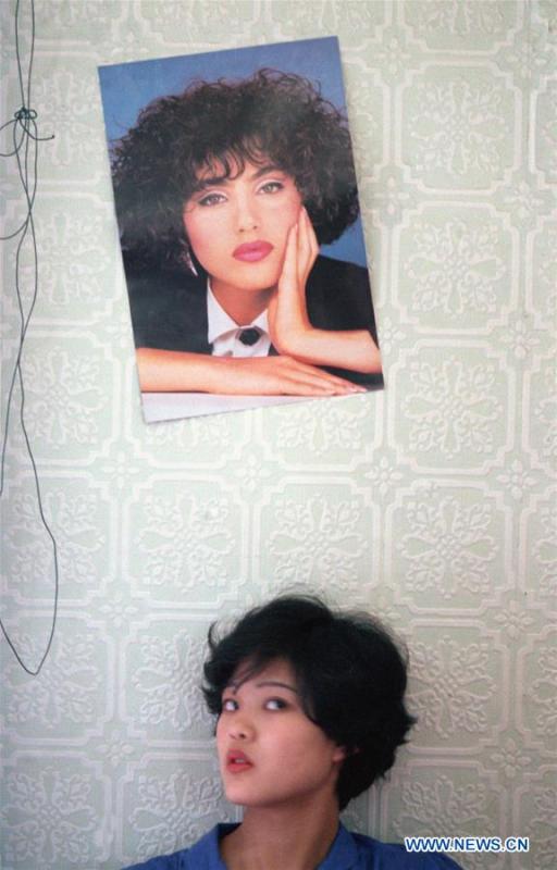 A woman is seen at a barber shop in Beijing, capital of China, Sept. 22, 1987. Along with China\'s reform and opening-up starting from 1978, Chinese women have refreshed their images year after year, which can be simply seen from their hairstyles. Women\'s hairstyles, just like a mirror, reflect fashion changes and most importantly, Chinese women\'s increasingly diversified definition of beauty. (Xinhua/Tang Shizeng)