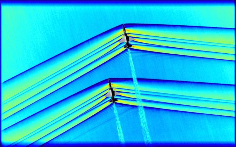 One of the greatest challenges of the flight series was timing. In order to acquire this image, originally monochromatic and shown here as a colorized composite image, NASA flew a B-200, outfitted with an updated imaging system, at around 30,000 feet while the pair of T-38s were required to not only remain in formation, but to fly at supersonic speeds at the precise moment they were directly beneath the B-200. The images were captured as a result of all three aircraft being in the exact right place at the exact right time designated by NASA’s operations team. (Photo/NASA)