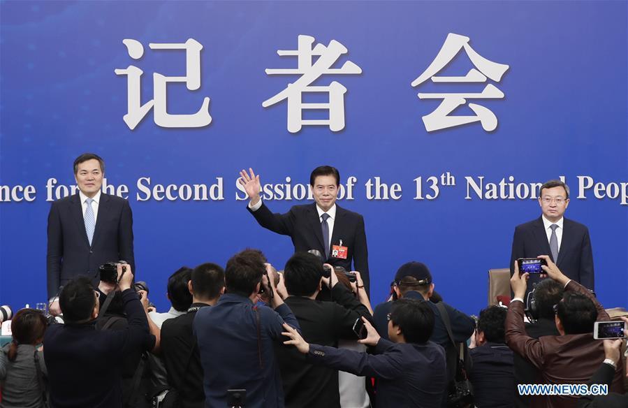 China\'s Minister of Commerce Zhong Shan (C), Vice Minister of Commerce and Deputy China International Trade Representative Wang Shouwen (R) and Vice Minister of Commerce Qian Keming attend a press conference on China\'s domestic market and all-round opening-up for the second session of the 13th National People\'s Congress (NPC) in Beijing, capital of China, March 9, 2019. (Xinhua/Shen Bohan)