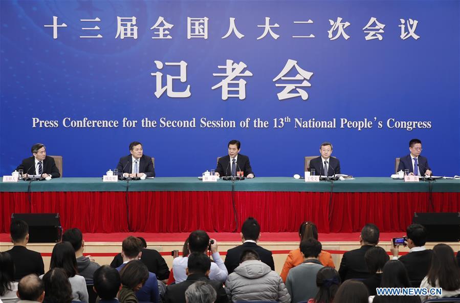 China\'s Minister of Commerce Zhong Shan (C), Vice Minister of Commerce and Deputy China International Trade Representative Wang Shouwen (2nd R) and Vice Minister of Commerce Qian Keming (2nd L) attend a press conference on China\'s domestic market and all-round opening-up for the second session of the 13th National People\'s Congress (NPC) in Beijing, capital of China, March 9, 2019. (Xinhua/Shen Bohan)