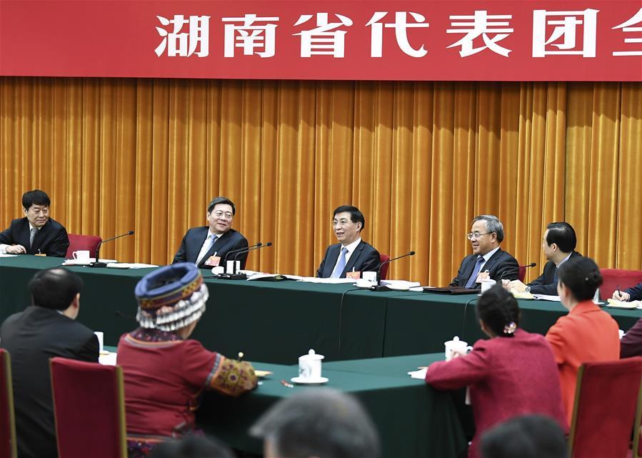 Wang Huning, a member of the Standing Committee of the Political Bureau of the Communist Party of China (CPC) Central Committee and a member of the Secretariat of the CPC Central Committee, joins deliberation with deputies from Hunan Province at the second session of the 13th National People\'s Congress in Beijing, capital of China, March 8, 2019. (Xinhua/Yan Yan)