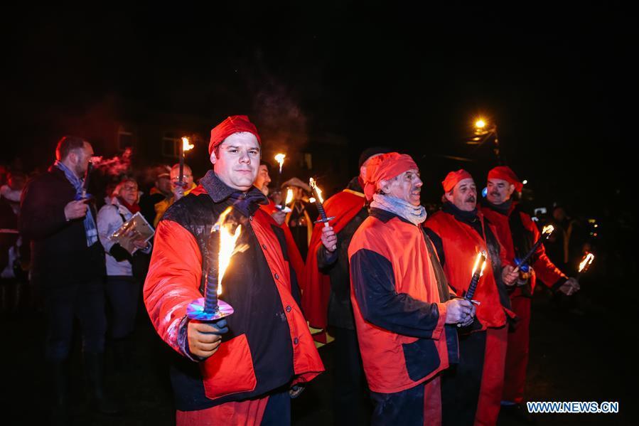 Local residents wearing traditional costumes attend the \