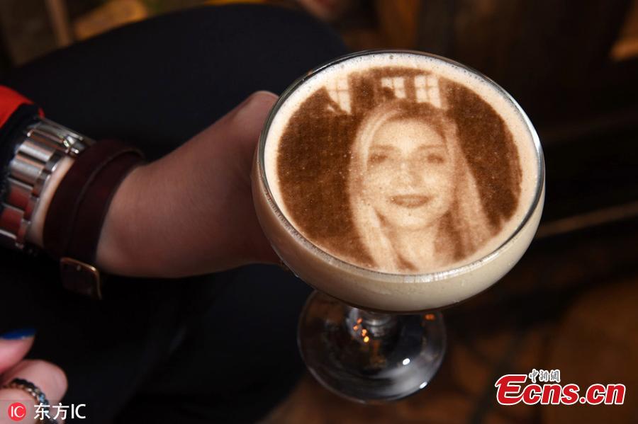 A customer demonstrates the process off uploading a selfie to the system and having it printed onto a cocktail at the bar. Bartenders at The Canal House in Birmingham city centre use a 3D printer to superimpose any image onto the foam atop an espresso, coffee or even a pint of Guinness. Staff said mainly selfies are chosen to adorn the boozy treat - which costs 8.95 - although they have had some more unusual requests.(Photo/Agencies)