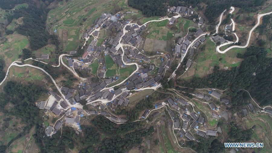 Aerial Photo taken on March 12, 2019 shows the winding concrete road at Paijie Village of Paidiao Township in Danzhai County, Miao and Dong Autonomous Prefecture of Qiandongnan, southwest China\'s Guizhou Province. The concrete road project in Guizhou was launched in August, 2017. Up to now, Guizhou has seen 77,700 kilometers of rural roads built or renovated with nearly 40,000 villages connected by concrete roads. Tens of millions of rural people benefit from the project. (Xinhua/Yang Wukui)