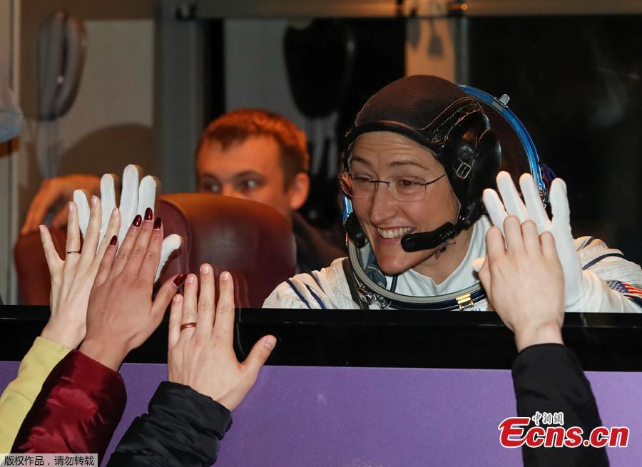 The International Space Station (ISS) crew member Christina Koch of the U.S. waves from a bus shortly before leaving to board the spacecraft at the Baikonur Cosmodrome, Kazakhstan March 14, 2019. (Photo/Agencies)