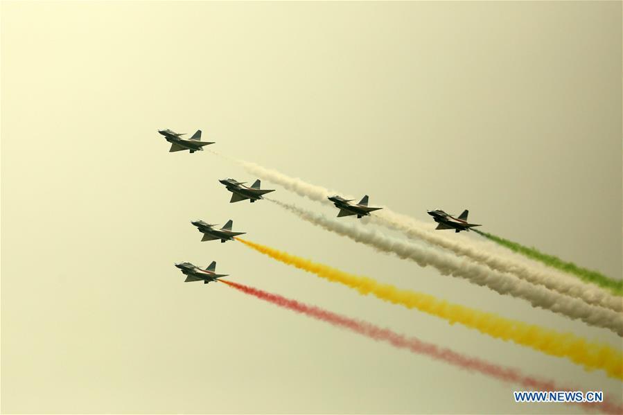 J-10 fighter jets of China\'s Bayi Aerobatic Team perform during the rehearsal of the Pakistan National Day army parade in Islamabad, capital of Pakistan, March 18, 2019. Pakistan National Day, also known as Pakistan Resolution Day or Republic Day, is celebrated annually on March 23. (Xinhua/Ahmad Kamal)