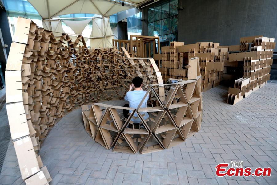 Art installations made using carton board are on display at the Museum of Xi\'an Jiaotong University in Xi\'an City, Shaanxi Province, March 18, 2019. Students used carton board to form small creations that feature ideas such as time travel. (Photo: China News Service/Zhang Yuan)
