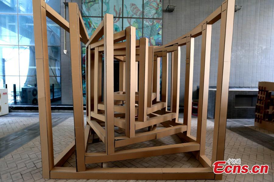 Art installations made using carton board are on display at the Museum of Xi\'an Jiaotong University in Xi\'an City, Shaanxi Province, March 18, 2019. Students used carton board to form small creations that feature ideas such as time travel. (Photo: China News Service/Zhang Yuan)