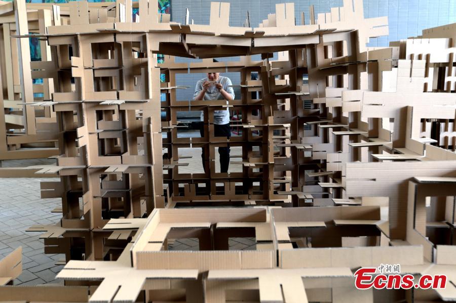 Art installations made using carton board are on display at the Museum of Xi\'an Jiaotong University in Xi\'an City, Shaanxi Province, March 18, 2019. Students used carton board to form small creations that feature ideas such as time travel. (Photo: China News Service/Zhang Yuan)