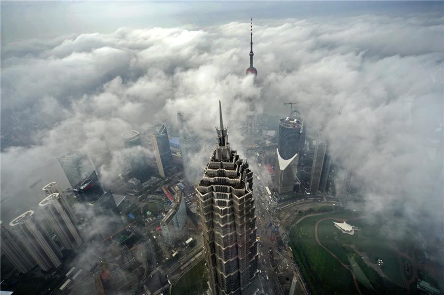 Jinmao Tower is part of the Lujiazui skyline seen from the Bund, along with the Oriental Pearl Tower, the Shanghai World Financial Center and the Shanghai Tower. (Photo by Zheng Xianzhang/for chinadaily.com.cn)