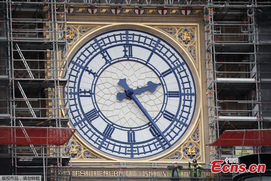 Photo taken on March 22, 2019 shows part of the clock tower revealed for the first time since restoration work began in 2017. And it shows a mostly blue face. (Photo/Agencies) 

Big Ben\'s north face is the first of the four famous clock faces to be seen in the original colour scheme from when it was built in 1859 by Sir Charles Barry.