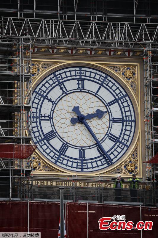Photo taken on March 22, 2019 shows part of the clock tower revealed for the first time since restoration work began in 2017. And it shows a mostly blue face. (Photo/Agencies)