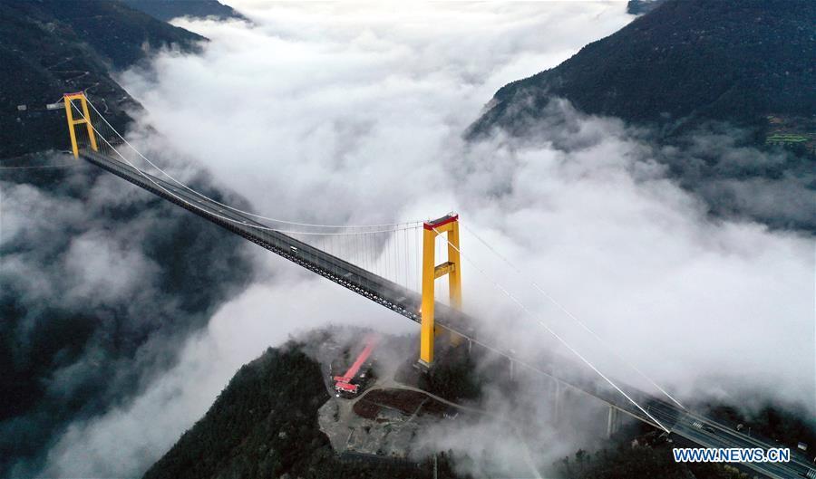 This aerial photo taken on March 23, 2019 shows the Siduhe Bridge on the Shanghai-Chongqing Highway in Yesanguan Town of Badong County in Enshi Tujia and Miao Autonomous Prefecture, central China\'s Hubei Province. The Siduhe Bridge, built 90 meters high and 560 meters up from the valley bottom, forms a landscape in Enshi. (Xinhua/Yang Shunpi)