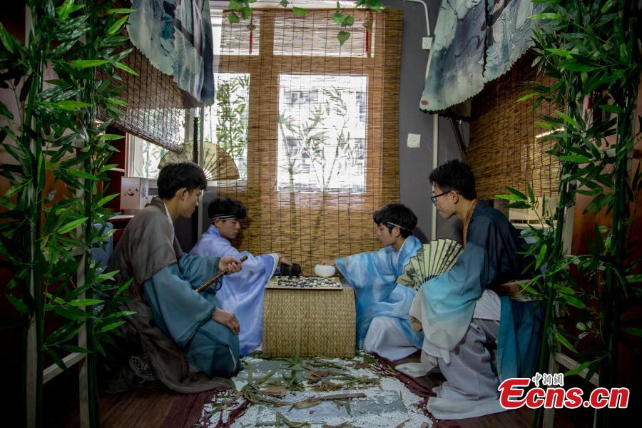 A newly-renovated dormitory room at the Wuhan Textile University Yangguang (Sunny) Campus in Wuhan City, Hubei Province, March 26, 2019. Four students have completely overhauled their dormitory room, decorating it with plastic bamboo trees, traditional window decorations and paintings reflecting Hui-style architecture. The four students are known to don traditional costumes and play Go, imitating the lifestyles of ancient Chinese scholars. (Photo: China News Service/Zhang Chang)