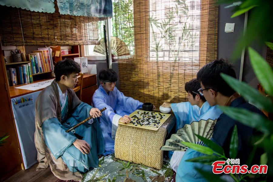 A newly-renovated dormitory room at the Wuhan Textile University Yangguang (Sunny) Campus in Wuhan City, Hubei Province, March 26, 2019. Four students have completely overhauled their dormitory room, decorating it with plastic bamboo trees, traditional window decorations and paintings reflecting Hui-style architecture. The four students are known to don traditional costumes and play Go, imitating the lifestyles of ancient Chinese scholars. (Photo: China News Service/Zhang Chang)