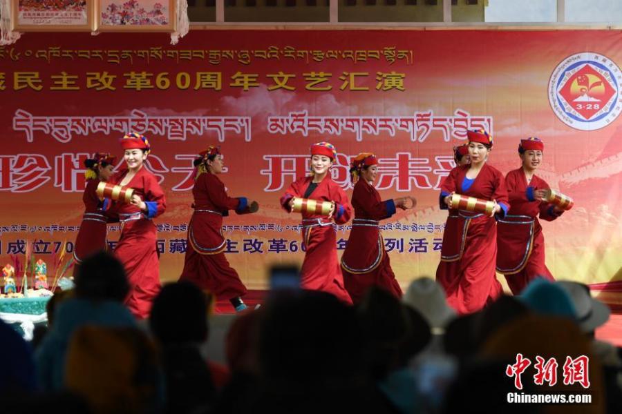 A performance marks the 60th anniversary of democratic reform in Lhasa, Southwest China\'s Tibet Autonomous Region, March 27, 2019. Various events, such as the flag-raising ceremony, performances and photo exhibitions to highlight the strides made in six decades, have been held across many areas in the autonomous region.  Thursday marks the 60th anniversary of democratic reform that abolished ruthless theocracy and serfdom, and established a socialist system that has seen booming economic, political, religious, cultural and social development on the plateau. (Photo: China News Service/He Penglei)