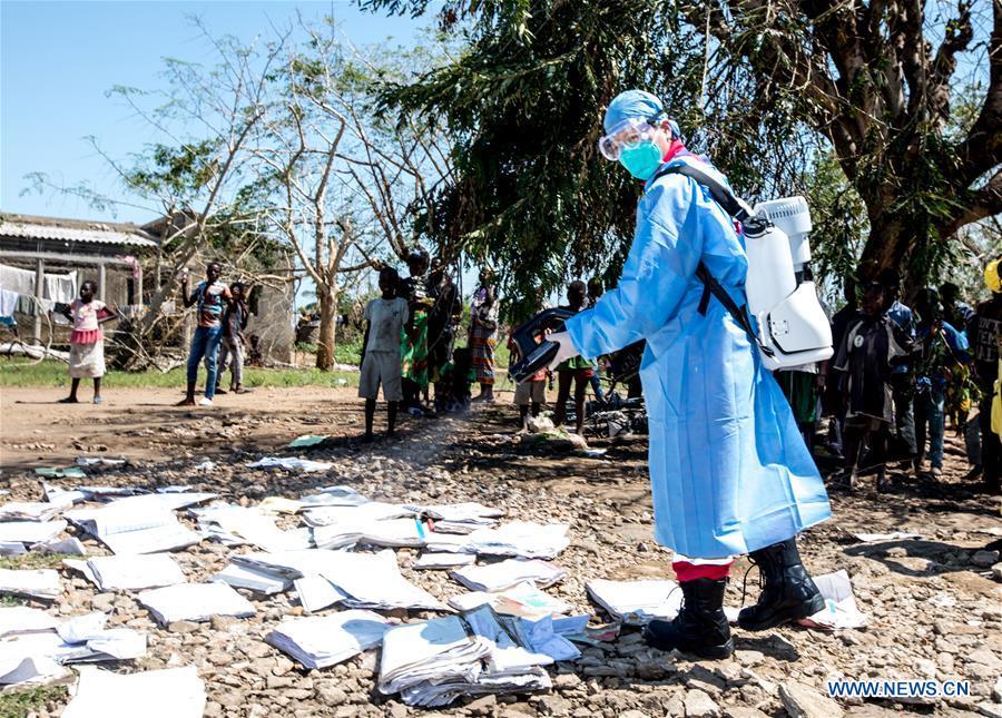 A member of Chinese rescue team carries out disinfection work in Lamago Village, 90 km from Beira, Mozambique, March 26, 2019. A Chinese rescue team went to Lamago Village to carry out disaster relief work on Tuesday. (Xinhua/Zhang Yu)
