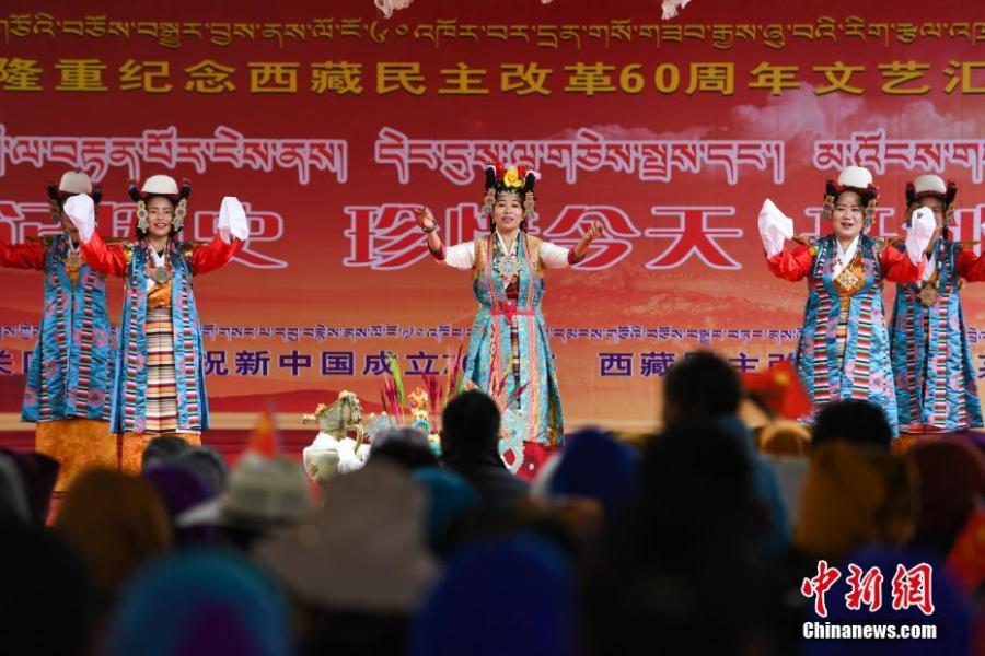 A performance marks the 60th anniversary of democratic reform in Lhasa, Southwest China\'s Tibet Autonomous Region, March 27, 2019. Various events, such as the flag-raising ceremony, performances and photo exhibitions to highlight the strides made in six decades, have been held across many areas in the autonomous region.  Thursday marks the 60th anniversary of democratic reform that abolished ruthless theocracy and serfdom, and established a socialist system that has seen booming economic, political, religious, cultural and social development on the plateau. (Photo: China News Service/He Penglei)