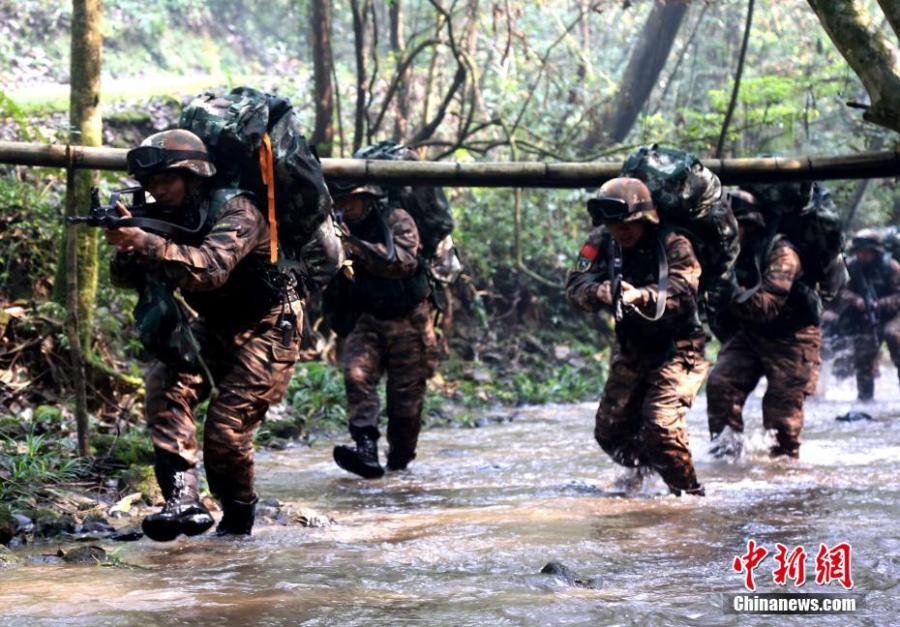 Armed police undergo intensive training in Sanming City, Fujian Province. The training included challenging search and rescue operations and aimed to enhance preparedness against terrorism. (Photo: China News Service/Hu Xin)