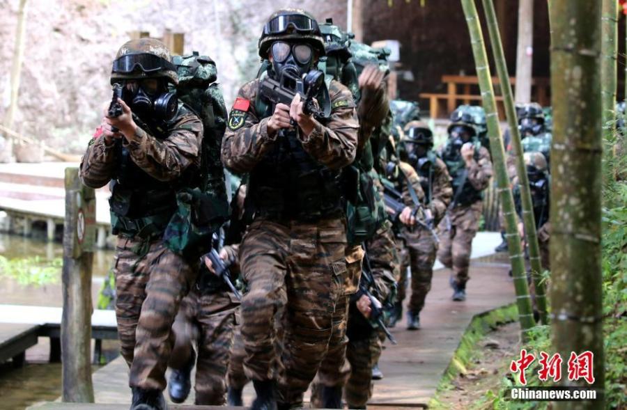 Armed police undergo intensive training in Sanming City, Fujian Province. The training included challenging search and rescue operations and aimed to enhance preparedness against terrorism. (Photo: China News Service/Luo Wu)