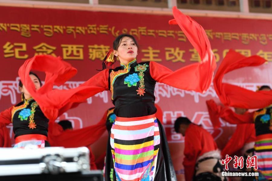 A performance marks the 60th anniversary of democratic reform in Lhasa, Southwest China\'s Tibet Autonomous Region, March 27, 2019. Various events, such as the flag-raising ceremony, performances and photo exhibitions to highlight the strides made in six decades, have been held across many areas in the autonomous region.  Thursday marks the 60th anniversary of democratic reform that abolished ruthless theocracy and serfdom, and established a socialist system that has seen booming economic, political, religious, cultural and social development on the plateau. (Photo: China News Service/He Penglei)