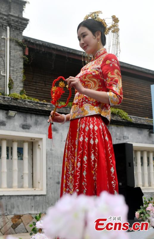 A wedding dress show held at the Three Lanes and Seven Alleys, a well-preserved architectural complex from the Ming and Qing dynasties in Fuzhou City, Fujian Province, March 31, 2019. Models from China and other countries presented wedding dresses that feature cultural traditions. (Photo: China News Service/Lyu Ming)