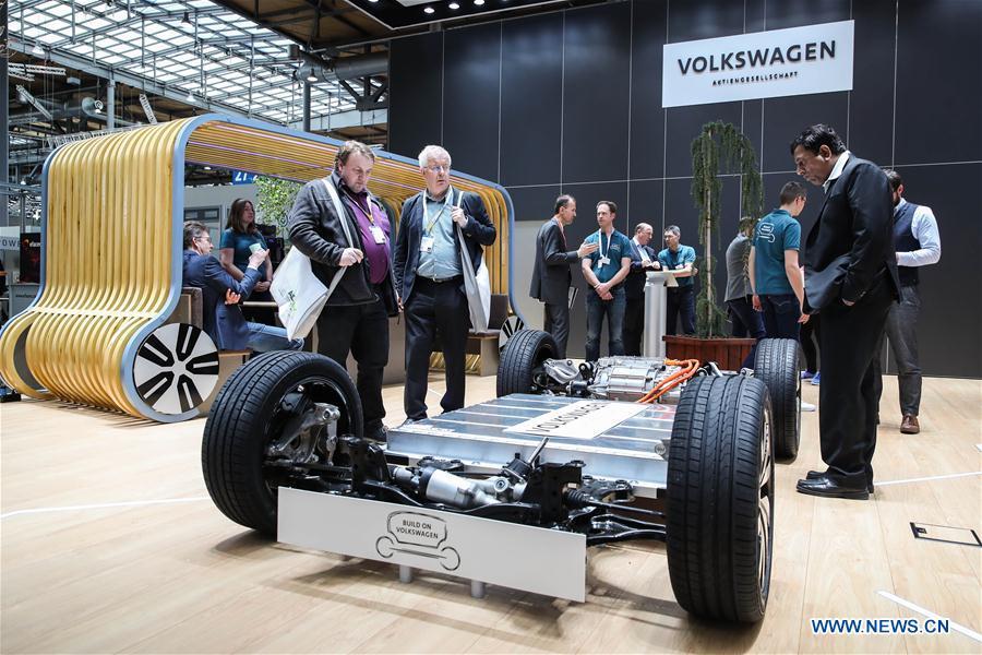Visitors look at a chassis displayed at the booth of Volkswagen during the 2019 Hanover Fair in Hanover, Germany, on April 1, 2019. With a total of 6,500 exhibitors from 75 countries and regions, the Hanover Fair shows the latest development of technologies for industrial use, including 5G network, artificial intelligence, light-weight manufacturing, among others. (Xinhua/Shan Yuqi)