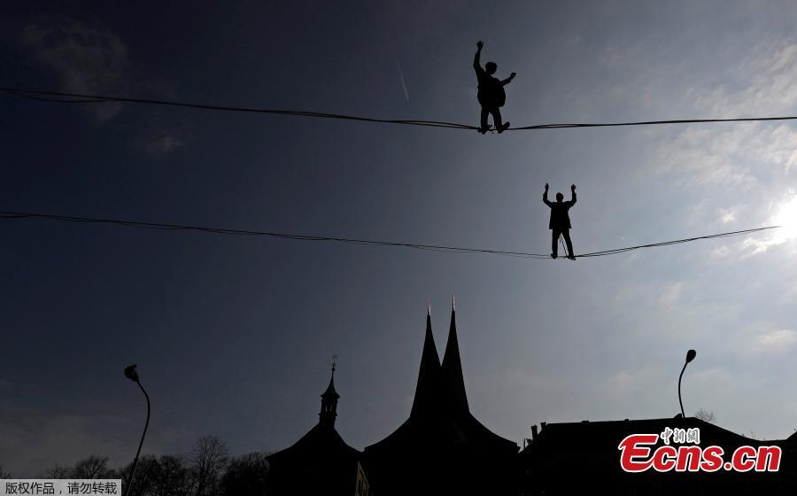 Tightrope walkers perform on ropes stretched over the Emmaus Monastery in Prague, Czech Republic, April 1, 2019.  (Photo/Agencies)