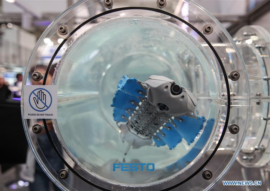 A bionic underwater robot is seen at the booth of Festo during the 2019 Hanover Fair in Hanover, Germany, on April 1, 2019. With a total of 6,500 exhibitors from 75 countries and regions, the Hanover Fair shows the latest development of technologies for industrial use, including 5G network, artificial intelligence, light-weight manufacturing among others. (Xinhua/Shan Yuqi)