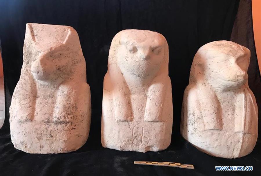 The undated photo provided by Egyptian Ministry of Antiquities on April 1, 2019 shows three small statues in Quesna city of Menoufia province, Egypt. An Egyptian archaeological mission uncovered a limestone-made coffin in Quesna city of Menouifia province, the country\'s Ministry of Antiquities said in a statement on Monday. \