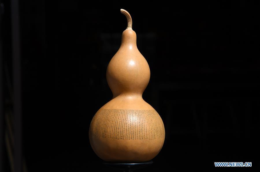 Photo taken on April 1, 2019 shows a carved gourd named \