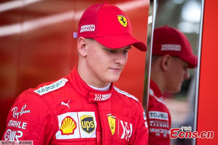 German Formula 2 driver Mick Schumacher walks out of Scuderia Ferrari offices during his first Formula One testing at the Sakhir circuit near Manama, Bahrain, Apr. 2, 2019.  (Photo/Agencies)