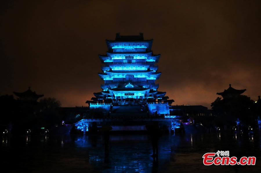 The historical Pavilion of Prince Teng is illuminated by blue lights during an event to mark World Autism Awareness Day, in Nanchang City, Jiangxi Province, April 2, 2019. The pavilion is on the east bank of the Ganjiang River and is one of the Three Great Towers of southern China. A total of 16 historical and cultural buildings in China took part in the light-up event to mark the day, which aims to raise awareness with Autism Spectrum Disorder throughout the world. (Photo: China News Service/Liu Zhankun)