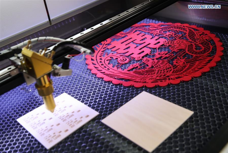 Photo taken on April 1, 2019 shows a traditional Chinese decoration made with a laser equipment at the booth of Chinese laser level manufacturer FST at Hanover Fair 2019 in Hanover, Germany. Over 1,400 Chinese exhibitors attended the fair, the second most just after the host country Germany. Huawei, Haier and other Chinese manufacturers showed their most advanced networking and artificial intelligence technologies to the world. (Xinhua/Shan Yuqi)