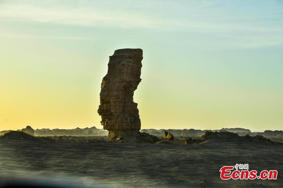A view of the unique Yadan landforms in the Moguicheng (Monster City) scenic spot at Dunhuang City, Northwest China\'s Gansu Province, in April 2019. Photography lovers flock to scenic area take photos of the dry landscape eroded by wind. (Photo: China News Service/Wang Binyin)