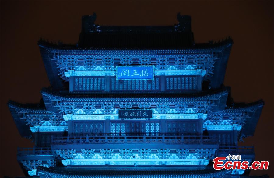 The historical Pavilion of Prince Teng is illuminated by blue lights during an event to mark World Autism Awareness Day, in Nanchang City, Jiangxi Province, April 2, 2019. The pavilion is on the east bank of the Ganjiang River and is one of the Three Great Towers of southern China. A total of 16 historical and cultural buildings in China took part in the light-up event to mark the day, which aims to raise awareness with Autism Spectrum Disorder throughout the world. (Photo: China News Service/Liu Zhankun)