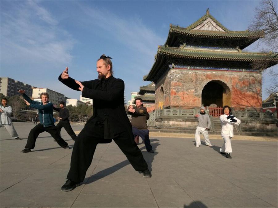 About 20 Chinese martial arts schools in the Wudang Mountain region have trained about 30,000 kung fu enthusiasts from around the world. (Photo provided to chinadaily.com.cn)

Yuan Xiugang, a member of the Wudang Martial Arts Association, has taught over 60 foreign students since 1995. One of his apprentices, Jack, a 29-year-old from Illinois in the U.S., first arrived in Wudang 10 years ago. Now Jack has become a kung fu coach.

\