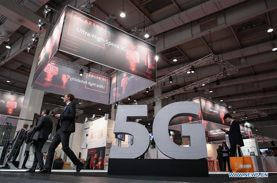 Visitors are seen at the 5G Arena during the 2019 Hanover Fair in Hanover, Germany, April 1, 2019. (Xinhua/Shan Yuqi)