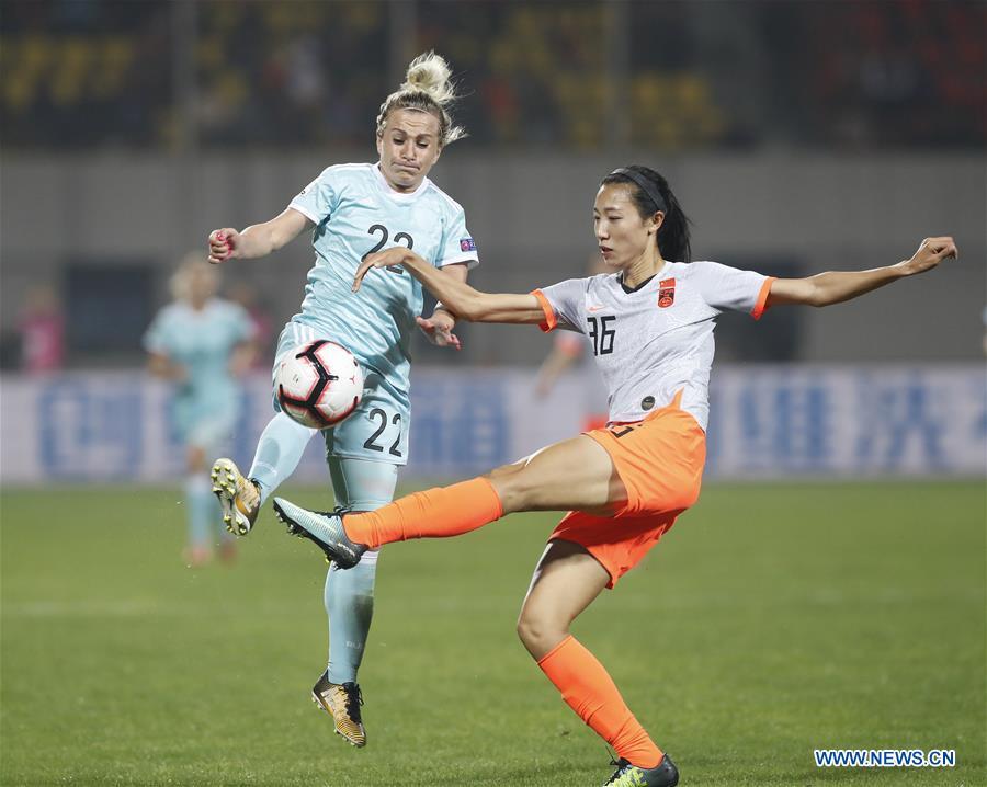Lin Yuping (R) of China vies with Nelli Korovkina of Russia during the match between China and Russia at the 2019 International Women\'s Football Tournament in Wuhan, central China\'s Hubei Province, April 4, 2019. China won 4-1. (Xinhua/Ding Xu)