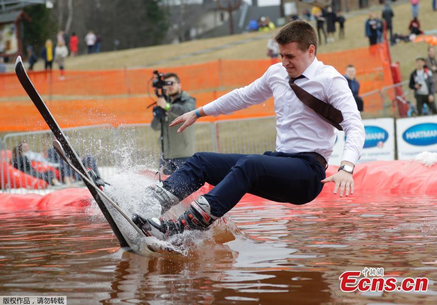 A snowboarder takes part in the comic competition \