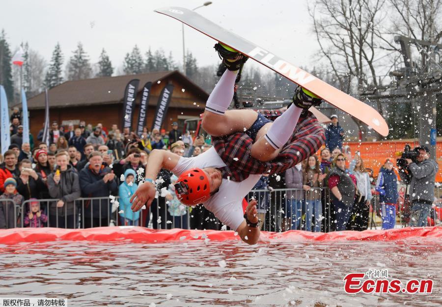 A snowboarder takes part in the comic competition \