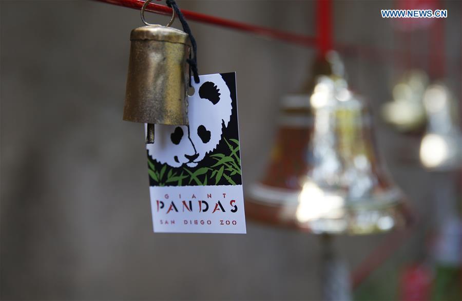 A wishing sign is seen on the Giant Panda Friendship Wall in San Diego Zoo in San Diego, the United States, April 6, 2019. The San Diego Zoo in the U.S. state of California held a special ceremony on Saturday to kick off a three-week farewell event for two giant pandas. Twenty-seven-year-old female giant panda Bai Yun and her son, six-year-old Xiao Liwu, will leave the zoo in late April and be sent back to China, as the zoo\'s conservation loan agreement with China has ended. (Xinhua/Li Ying)