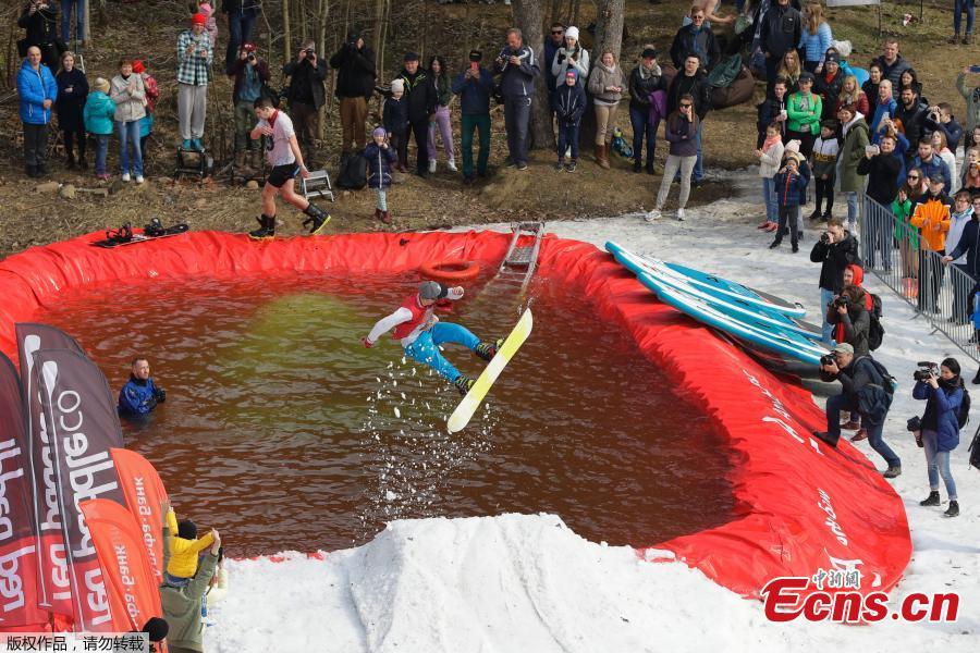 A snowboarder takes part in the comic competition \