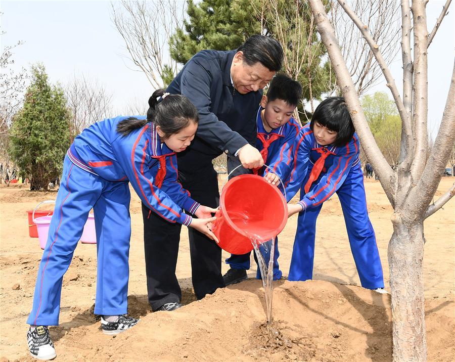 Chinese President Xi Jinping, also general secretary of the Communist Party of China Central Committee and chairman of the Central Military Commission, waters a sapling with school children as he attends a tree-planting activity in Tongzhou District in Beijing, capital of China, April 8, 2019. Other Party and state leaders, including Li Zhanshu, Wang Yang, Wang Huning, Zhao Leji, Han Zheng and Wang Qishan, also attended the activity. (Xinhua/Xie Huanchi)